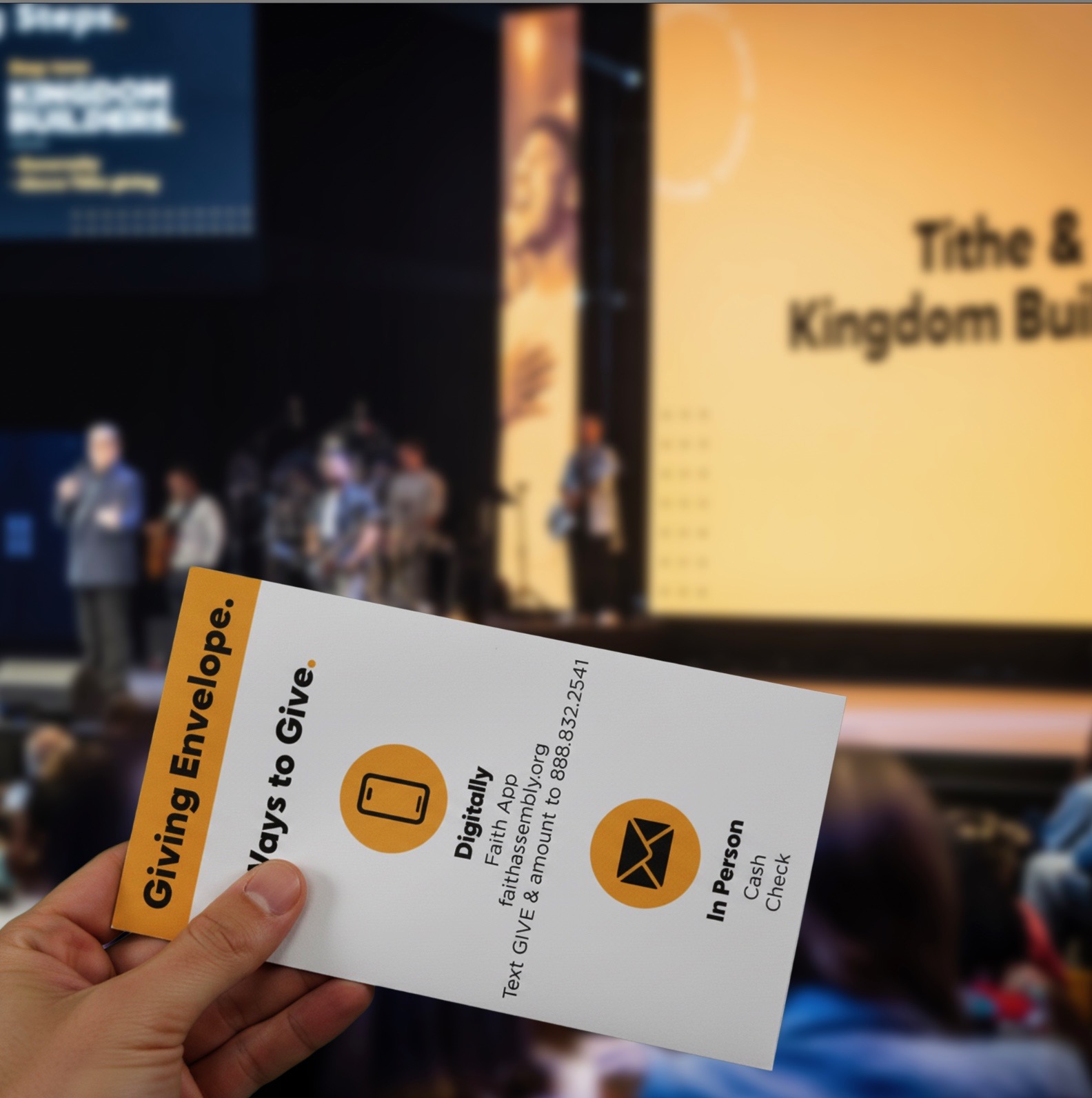 Person holding a giving envelope during service